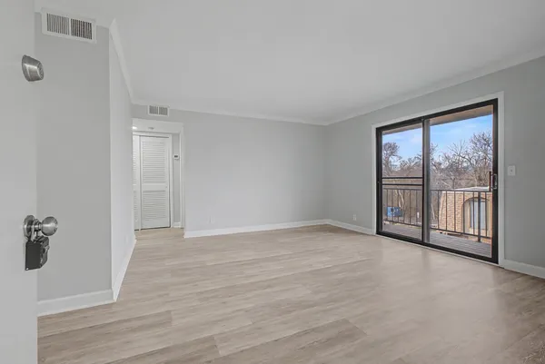 a view of an empty room with a window