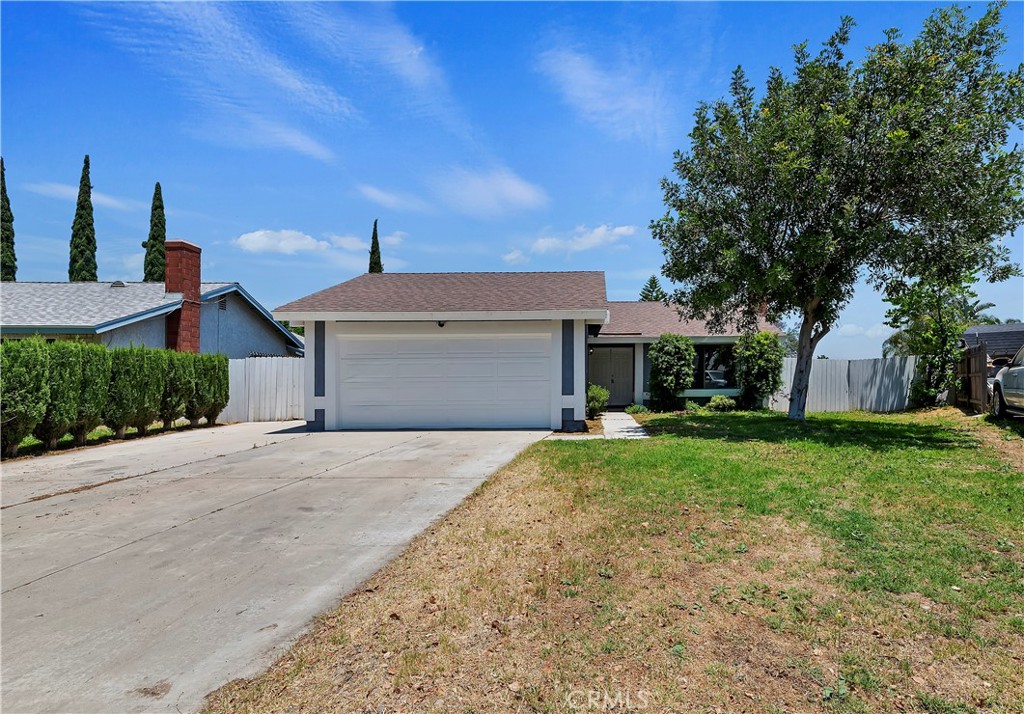 10219 Dunn Court Riverside, CA 92503 - Photo 1 of 1 a front view of a house with a yard and trees
