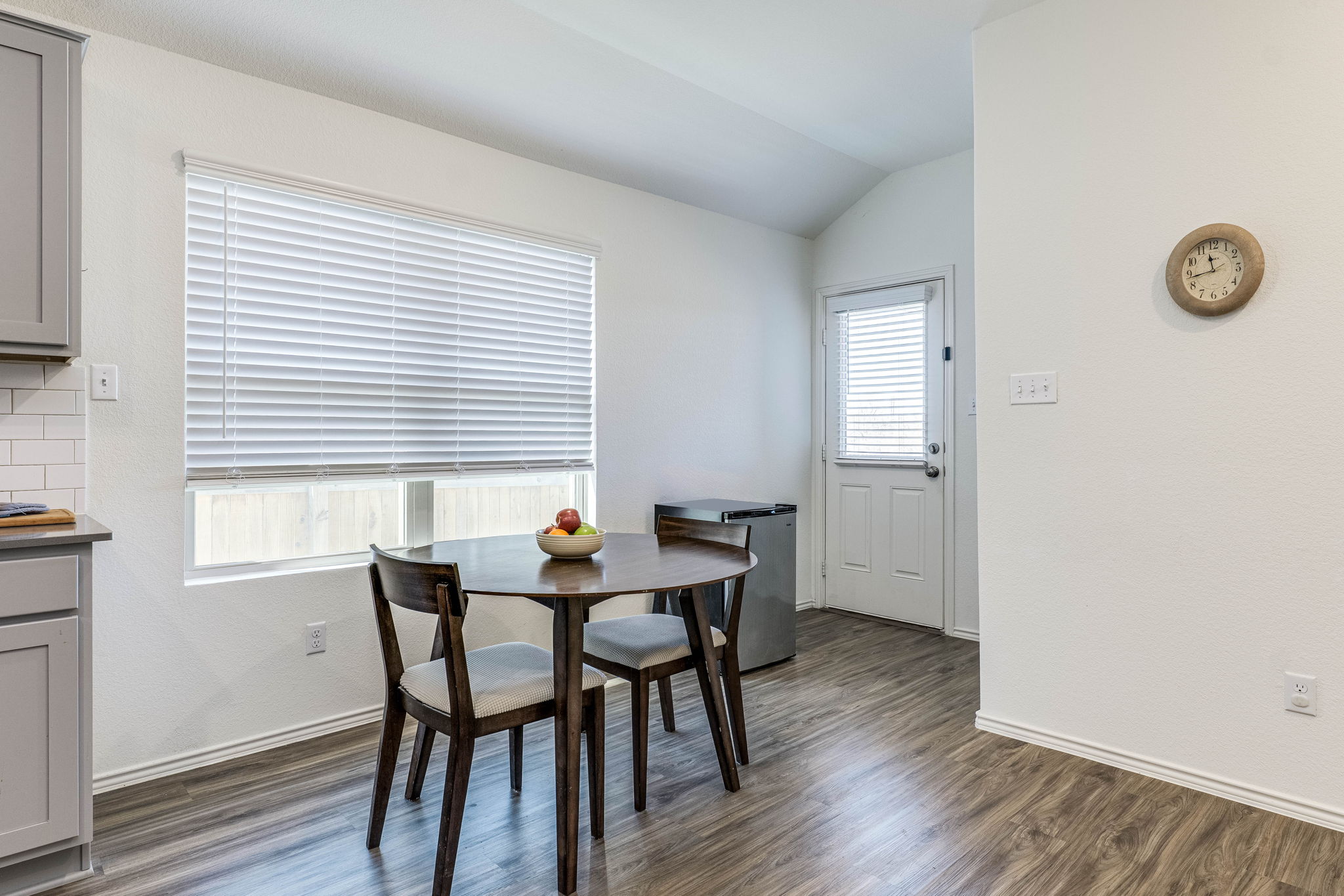 557 Greatest Gift Way Jarrell, TX 76537 - Photo 15 of 39 Dining room featuring dark wood finished floors and lofted ceiling