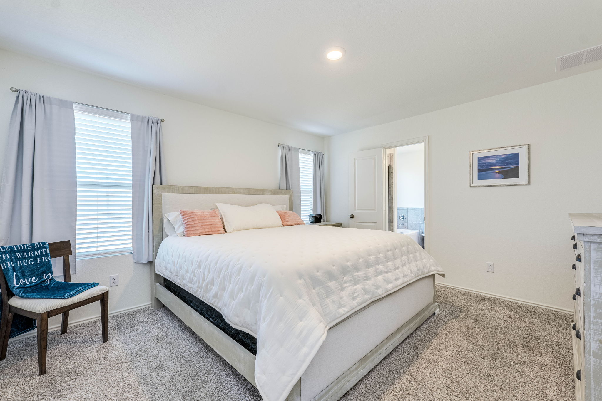 557 Greatest Gift Way Jarrell, TX 76537 - Photo 21 of 39 Bedroom featuring light colored carpet and baseboards