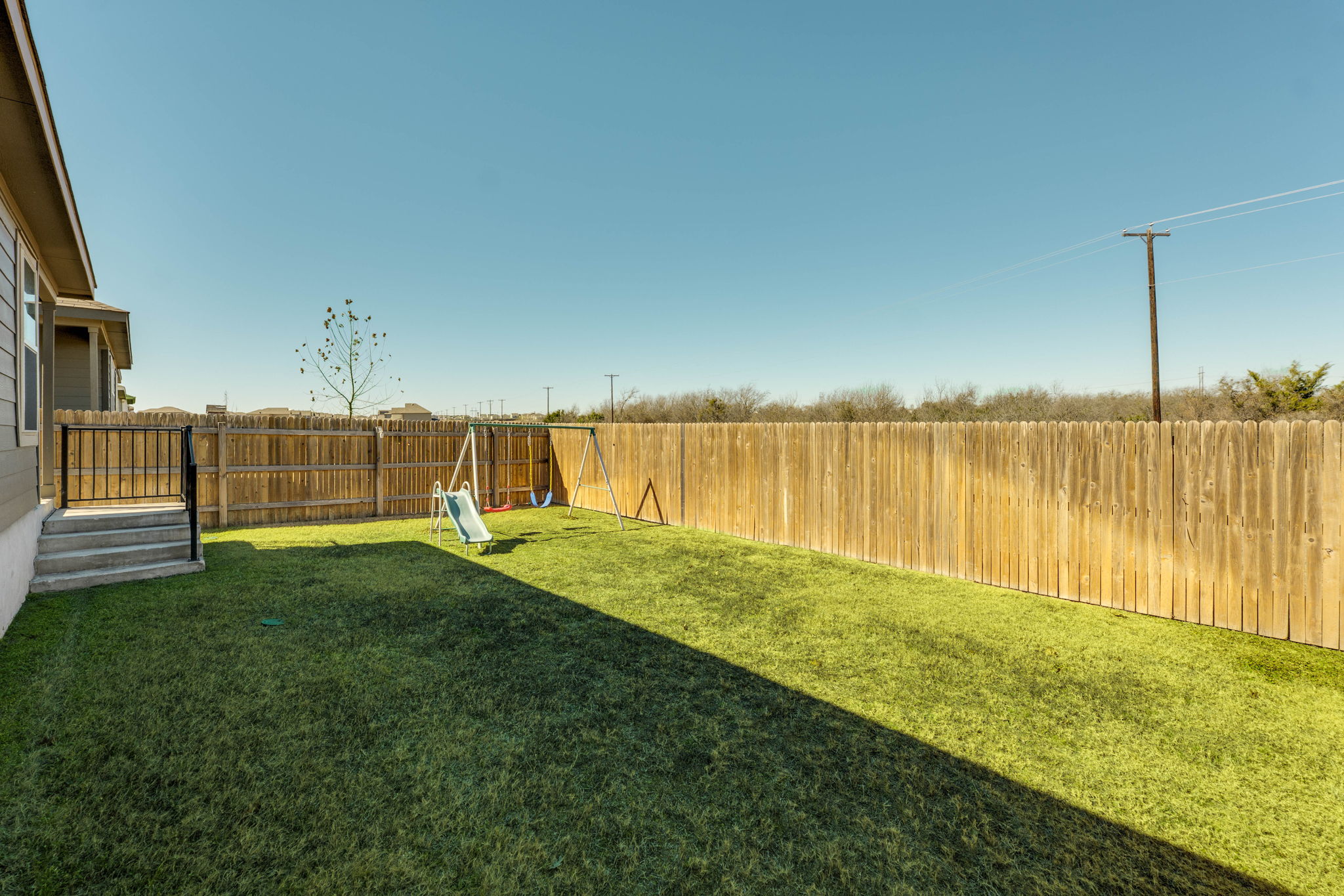 557 Greatest Gift Way Jarrell, TX 76537 - Photo 33 of 39 Fenced backyard with a playground