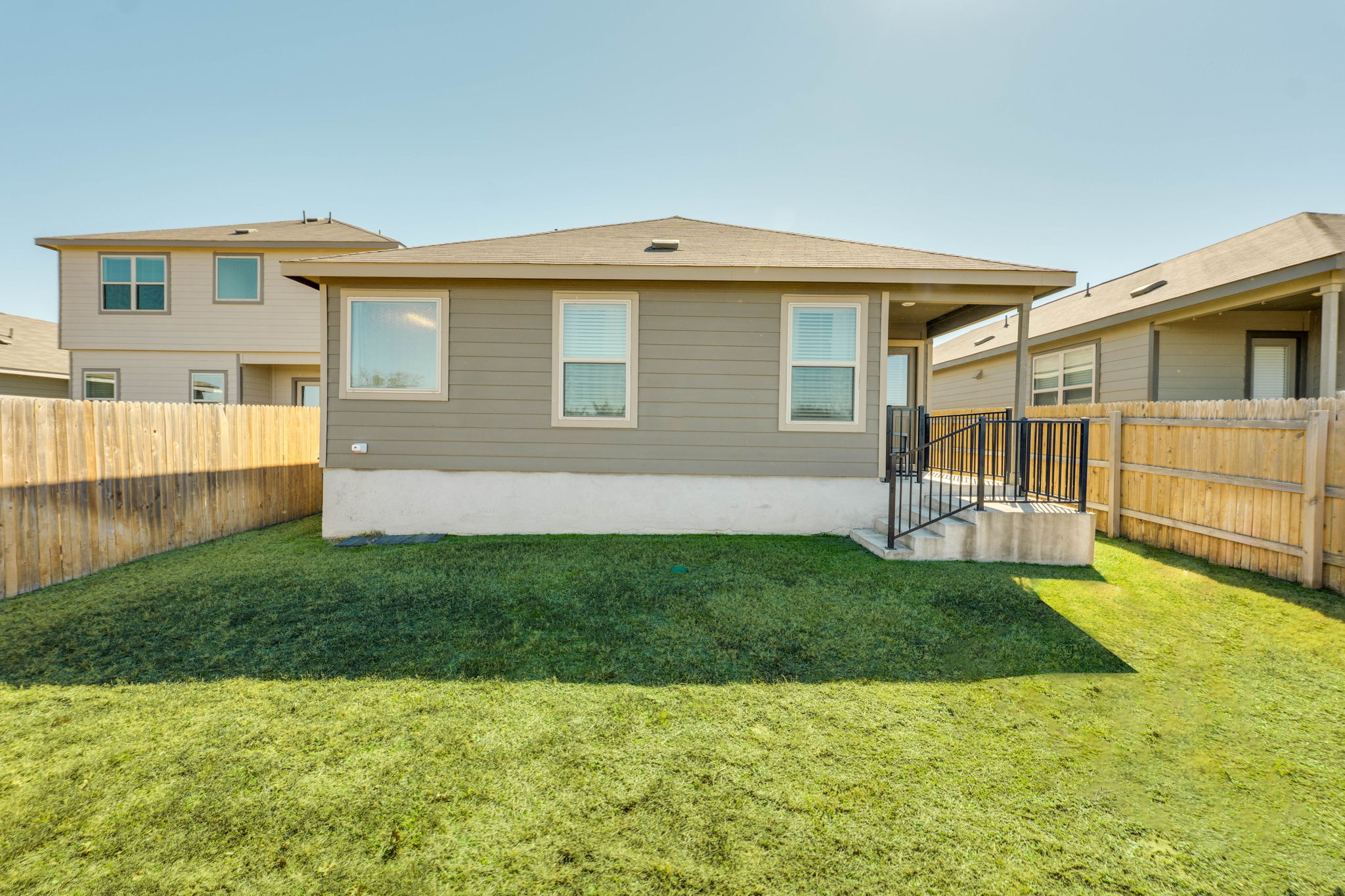557 Greatest Gift Way Jarrell, TX 76537 - Photo 35 of 39 Rear view of house with a fenced backyard