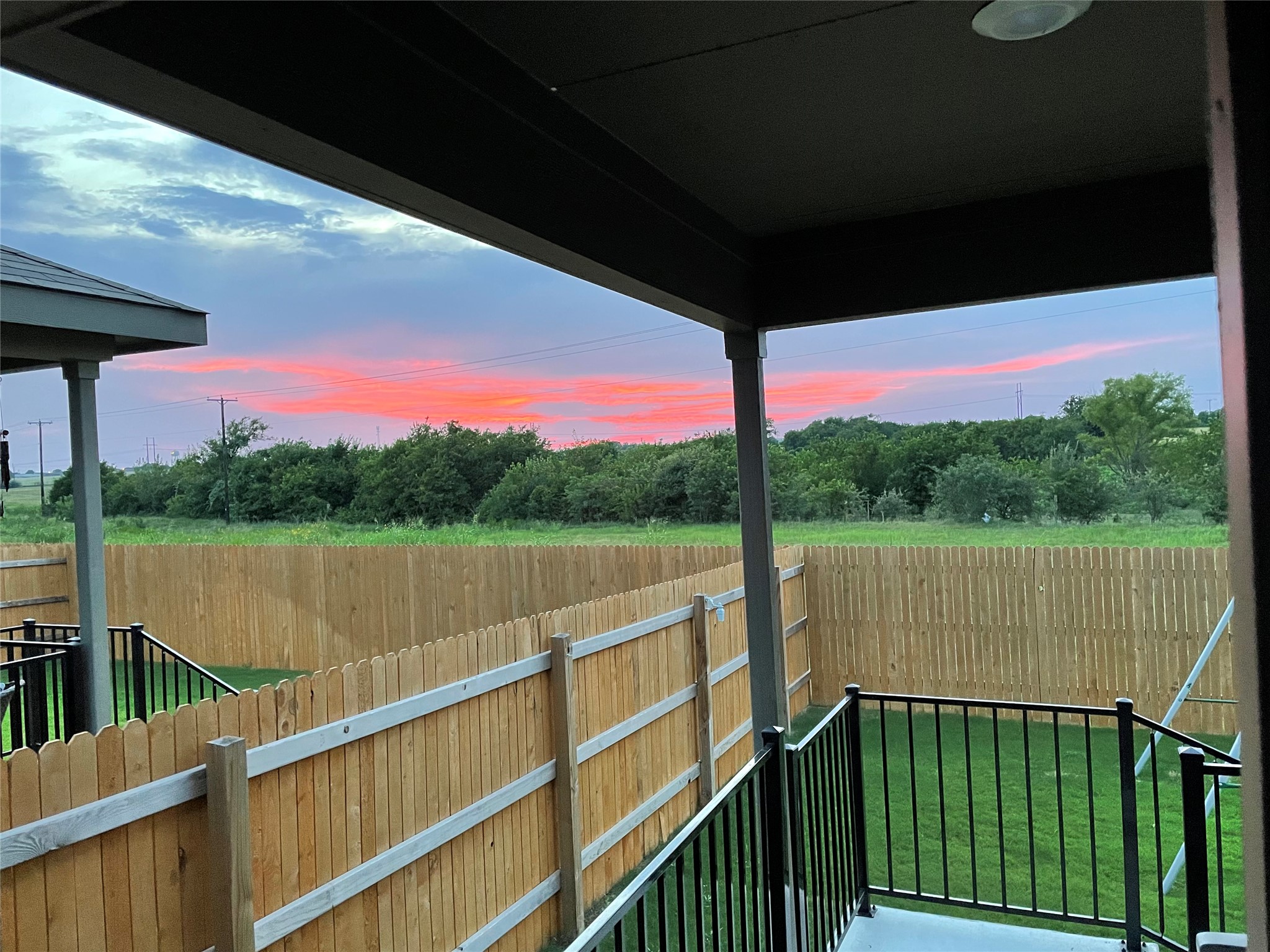 557 Greatest Gift Way Jarrell, TX 76537 - Photo 36 of 39 View of balcony at dusk