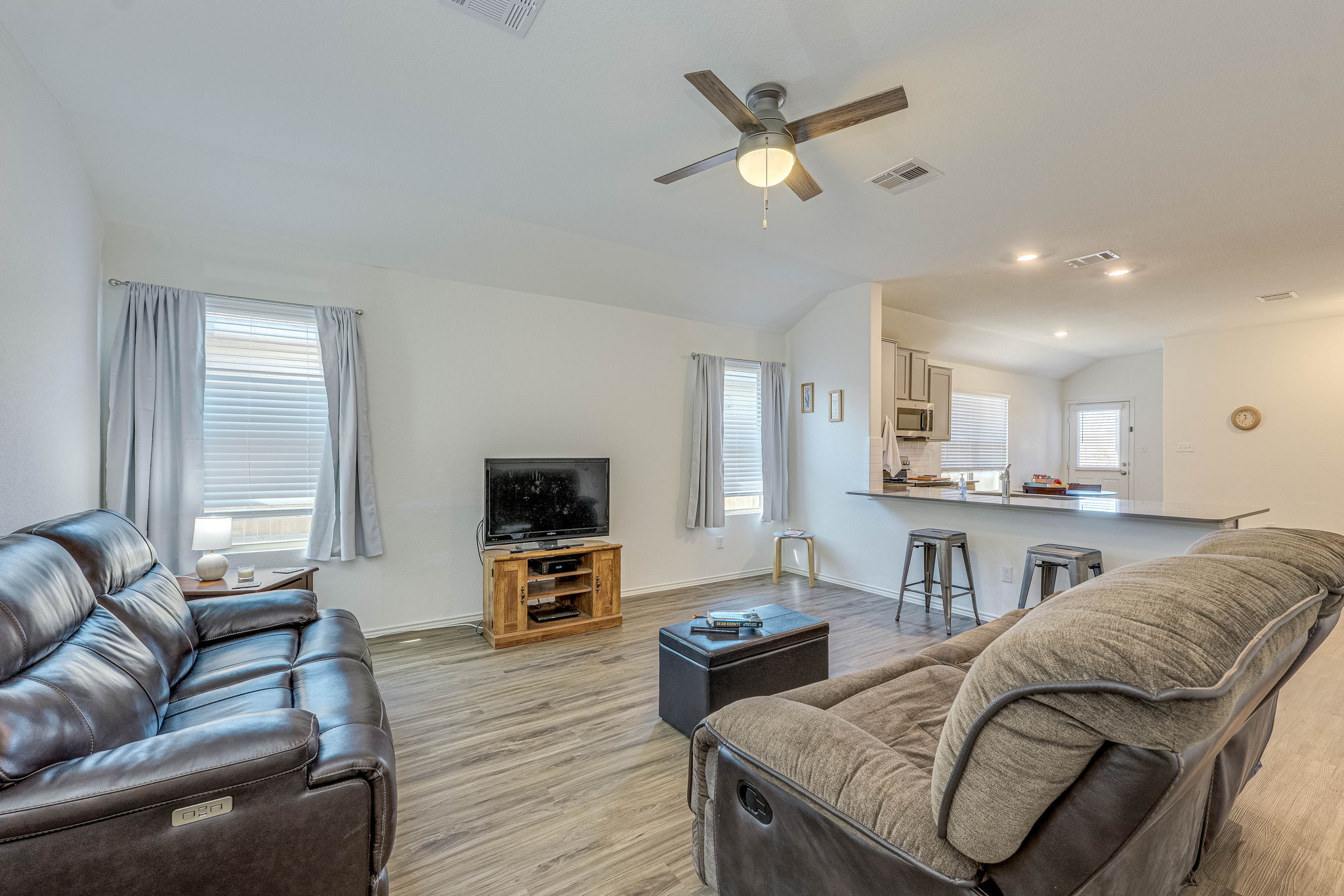 557 Greatest Gift Way Jarrell, TX 76537 - Photo 4 of 39 Living room with light wood-style floors, ceiling fan, lofted ceiling, and recessed lighting