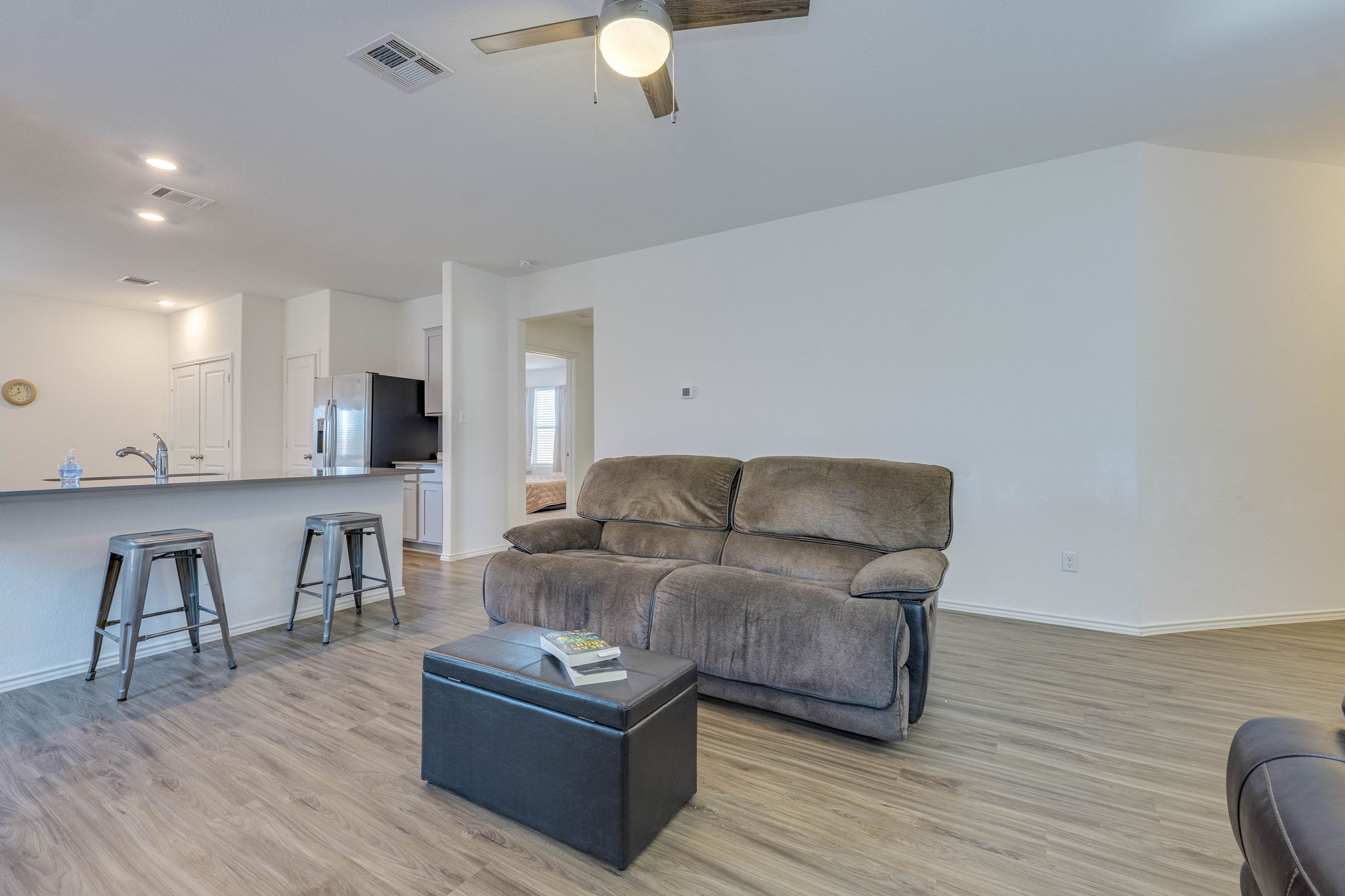 557 Greatest Gift Way Jarrell, TX 76537 - Photo 6 of 39 Living room with a ceiling fan, light wood-style floors, and recessed lighting