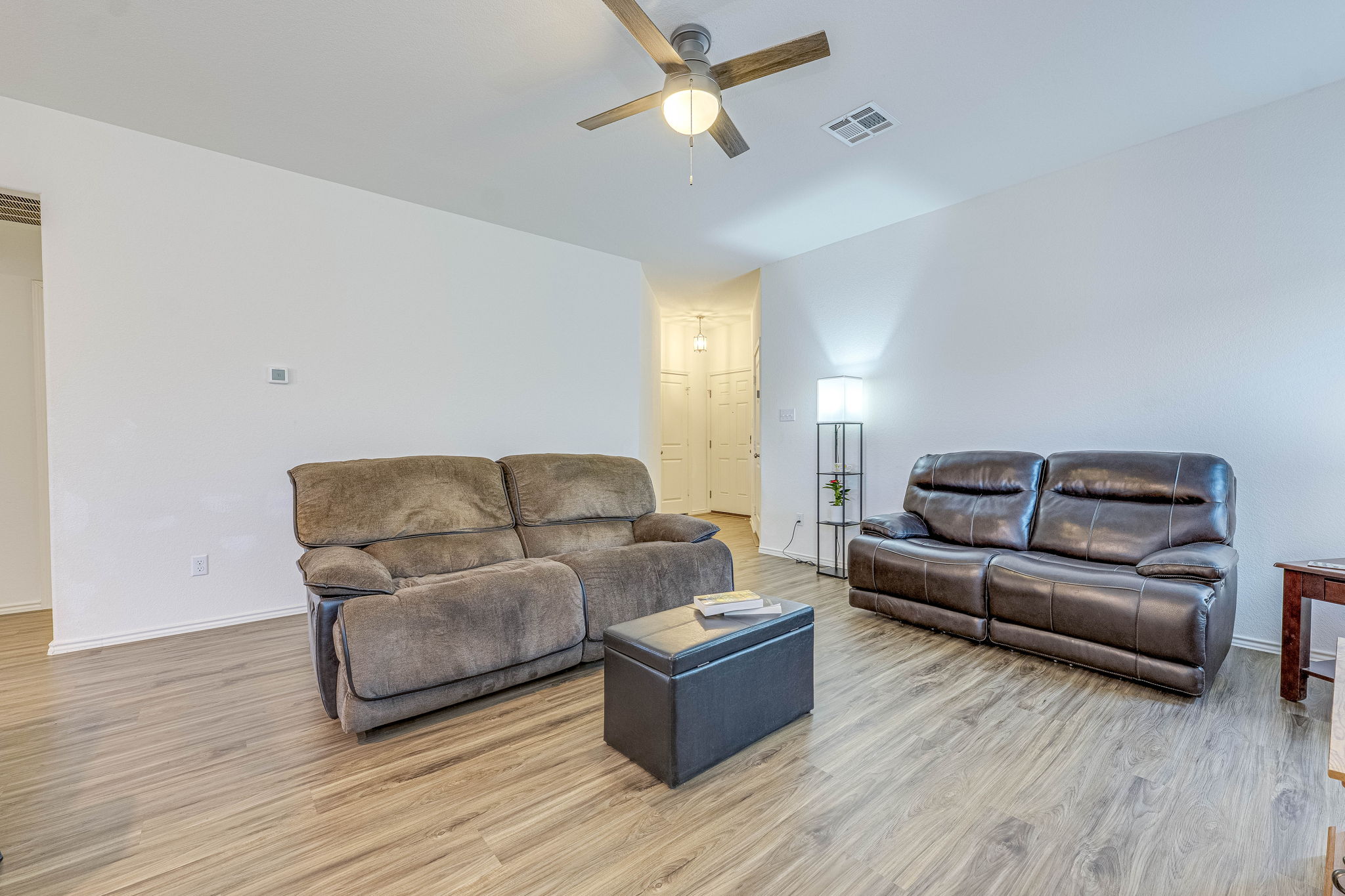 557 Greatest Gift Way Jarrell, TX 76537 - Photo 8 of 39 Living area with ceiling fan and light wood-style flooring