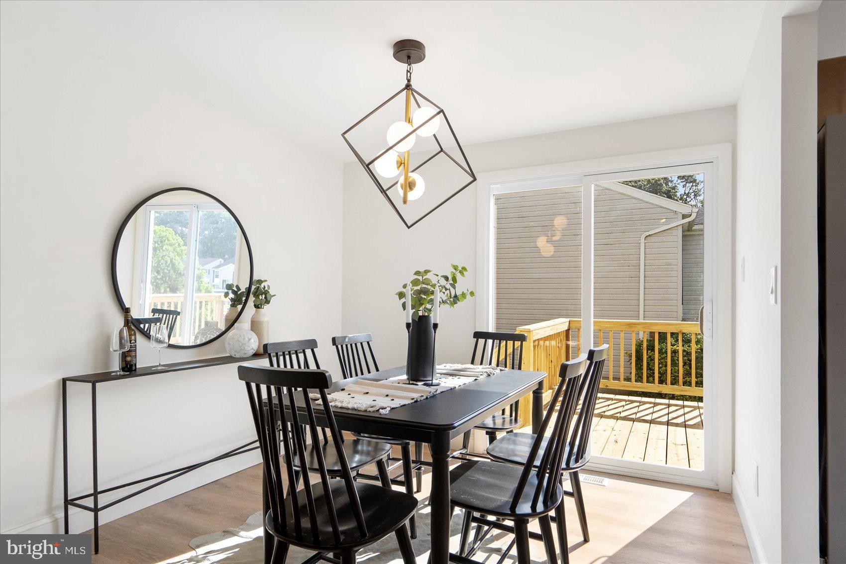 5425 Balistan Road Rosedale, MD 21237 - Photo 14 of 39 a view of a dining room with furniture window and wooden floor