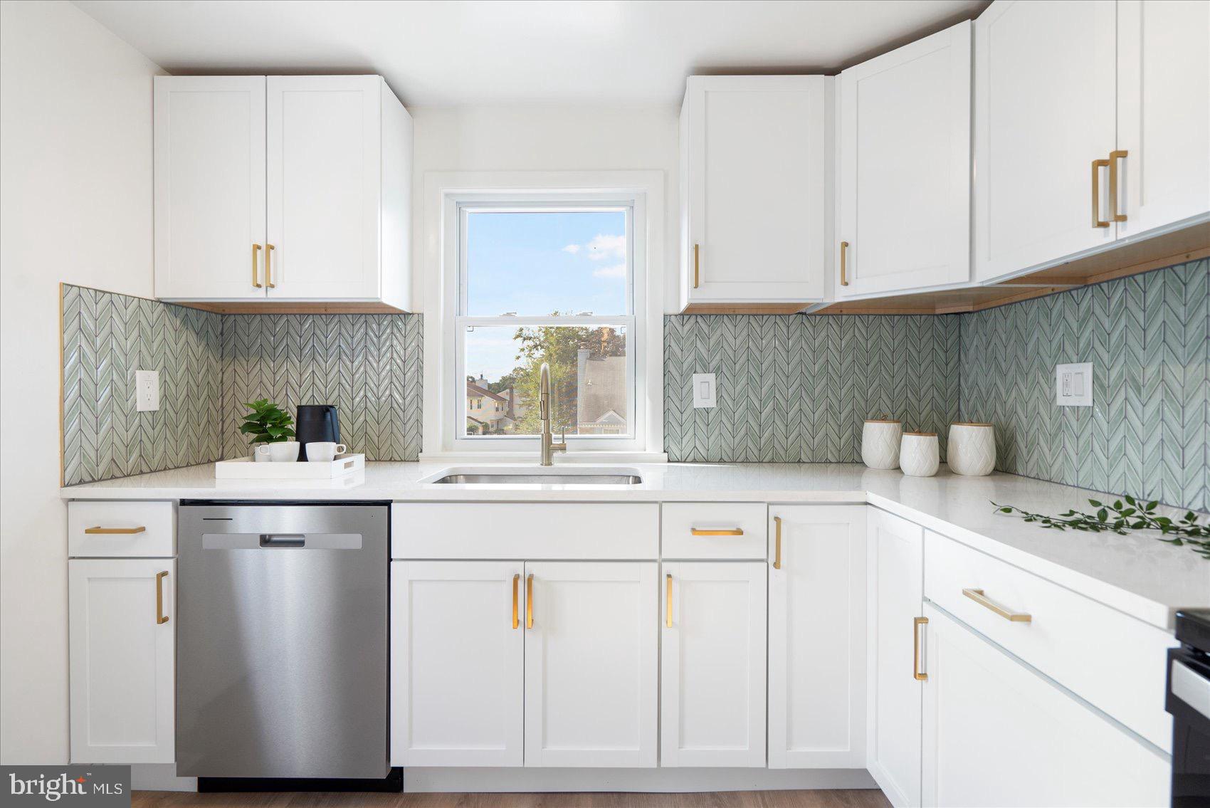 5425 Balistan Road Rosedale, MD 21237 - Photo 16 of 39 a kitchen with stainless steel appliances granite countertop a sink and cabinets