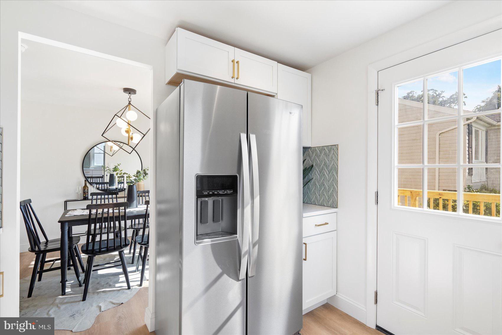 5425 Balistan Road Rosedale, MD 21237 - Photo 18 of 39 a kitchen with stainless steel appliances a refrigerator and a stove top oven