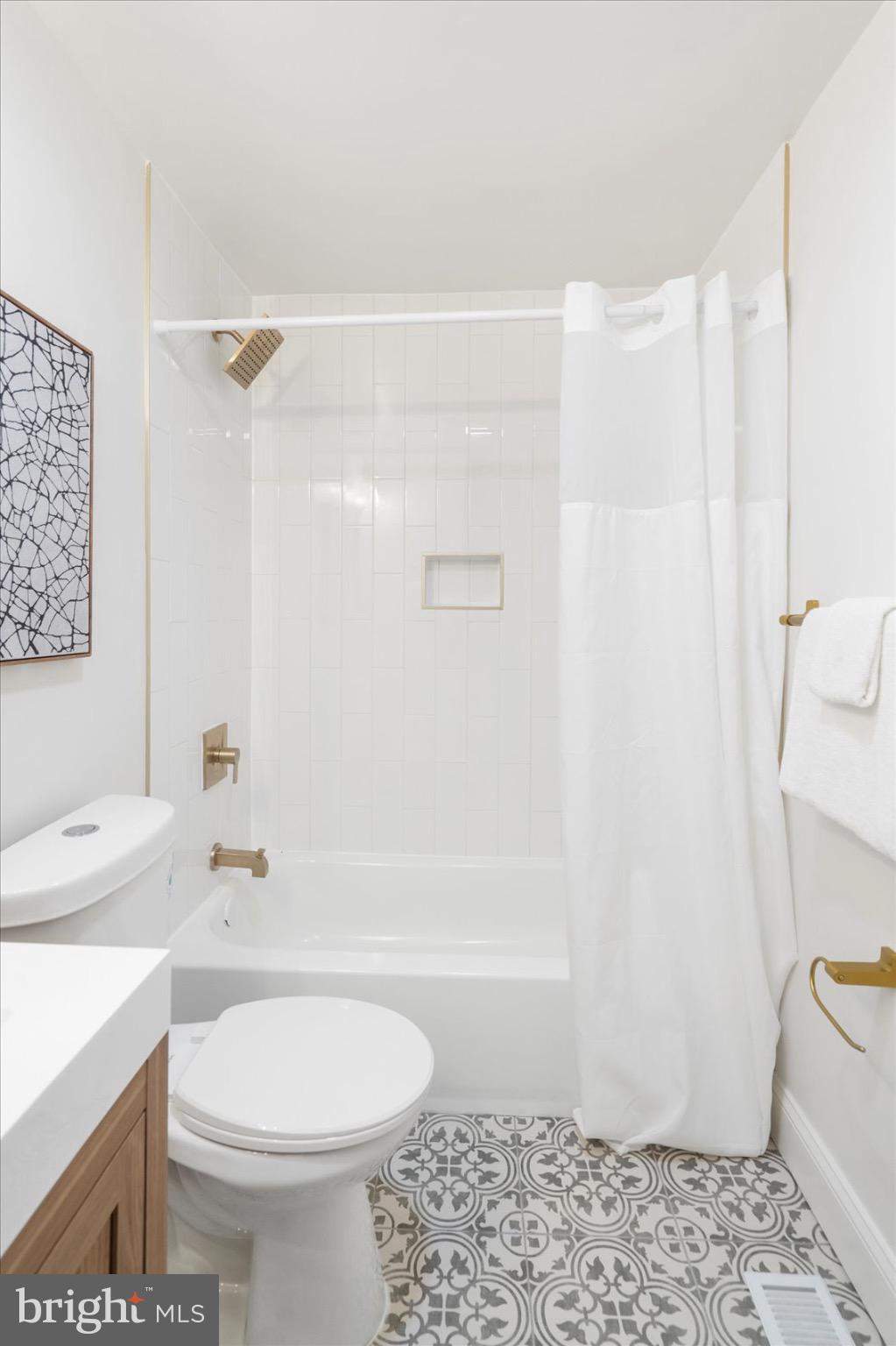 5425 Balistan Road Rosedale, MD 21237 - Photo 20 of 39 a bathroom with a sink a toilet and shower