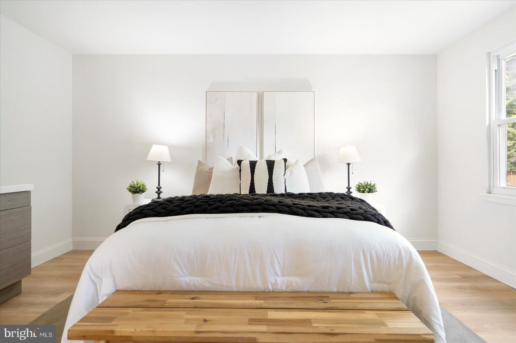 5425 Balistan Road Rosedale, MD 21237 - Photo 22 of 39 a bedroom with a bed and a night stand