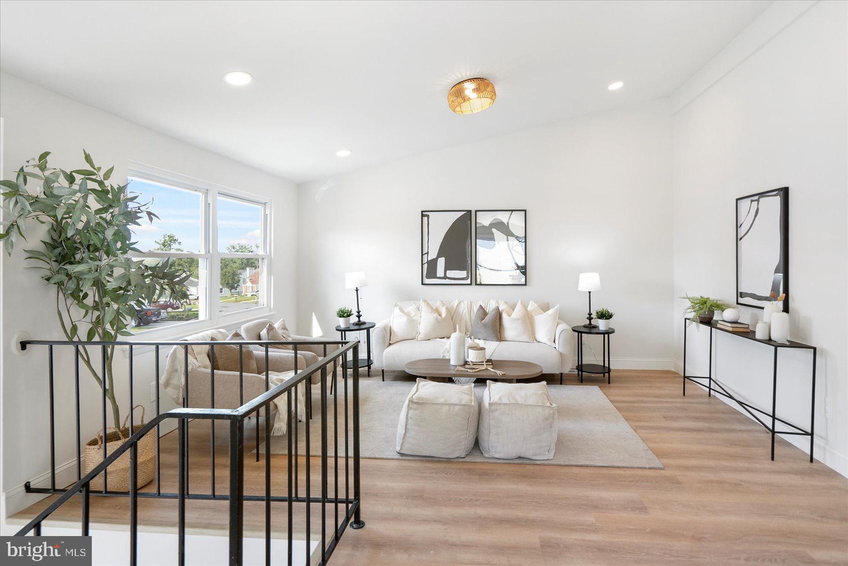 5425 Balistan Road Rosedale, MD 21237 - Photo 9 of 39 a living room with furniture and a wooden floor
