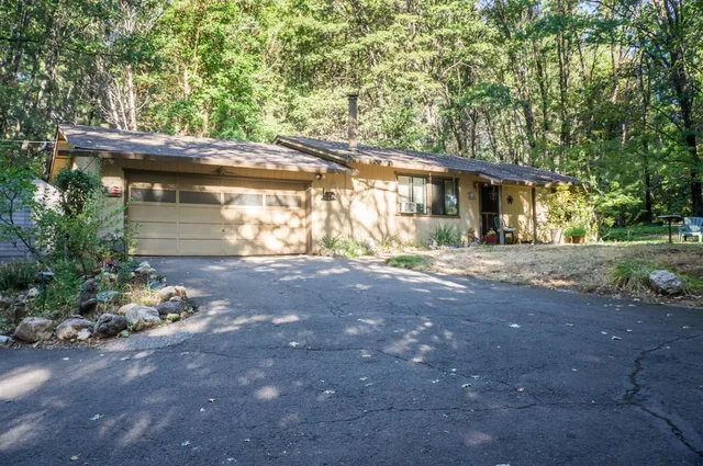 an outdoor view of house with green space