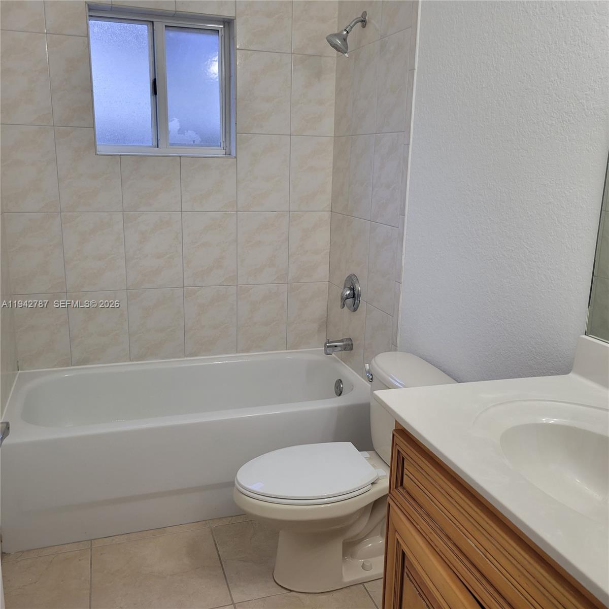 13383 Southwest 270th Street Homestead, FL 33032 - Photo 14 of 14 a bathroom with a sink a toilet and bathtub