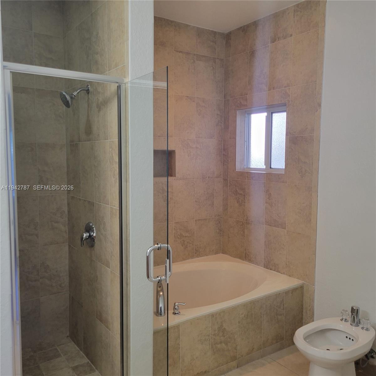 13383 Southwest 270th Street Homestead, FL 33032 - Photo 5 of 14 a bath room with a bath tub and a shower