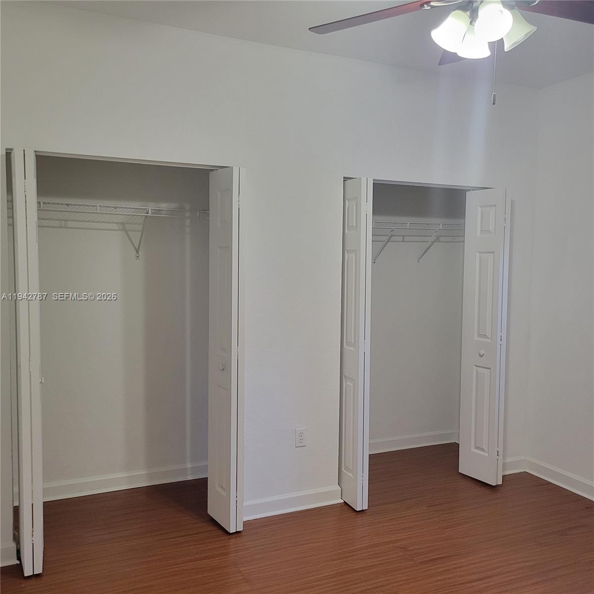 13383 Southwest 270th Street Homestead, FL 33032 - Photo 7 of 14 a view of an empty room with wooden floor