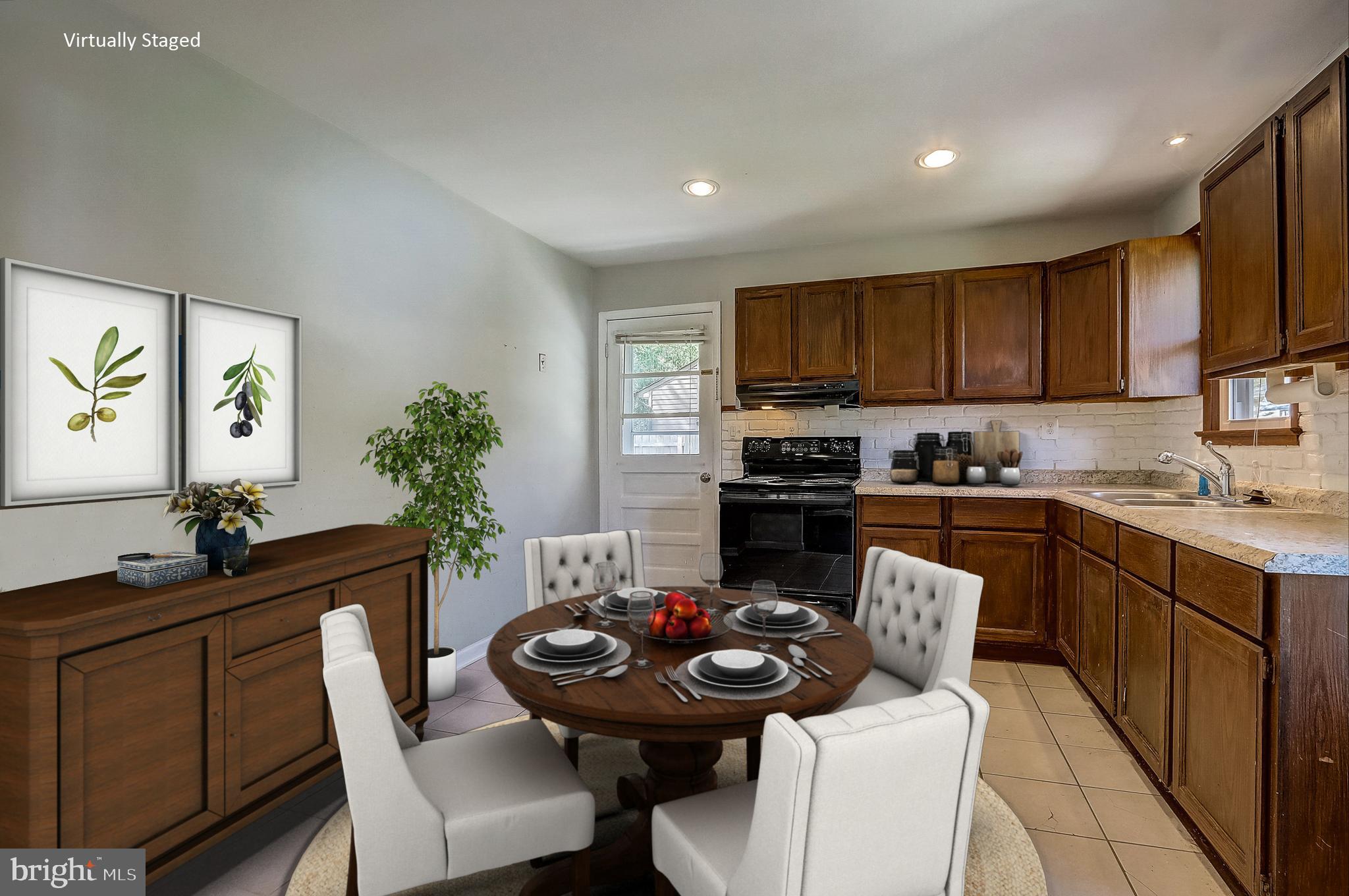 13221 Pine Road Bowie, MD 20720 - Photo 11 of 34 a kitchen with a sink stove and cabinets