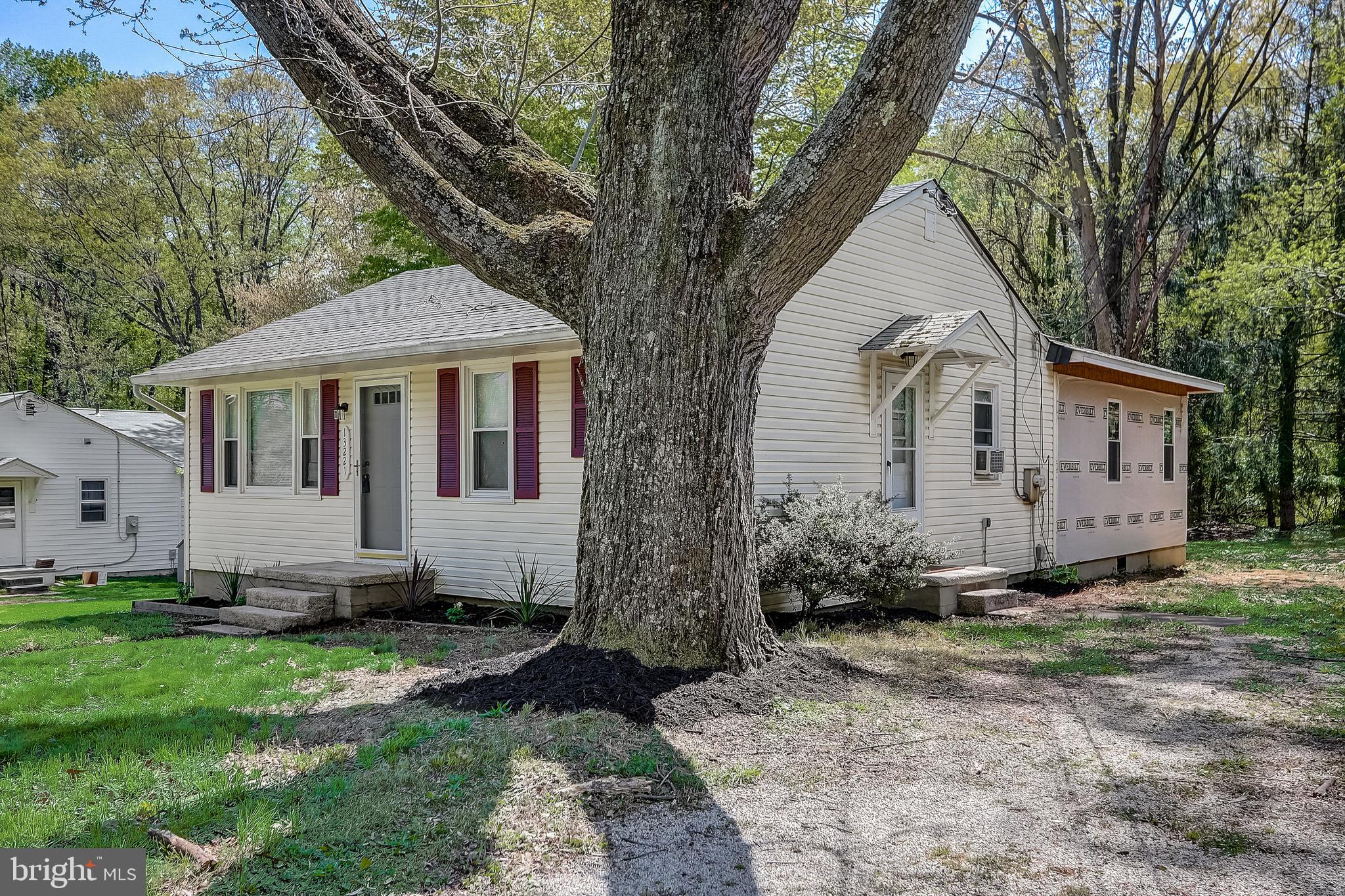 13221 Pine Road Bowie, MD 20720 - Photo 3 of 34 a front view of a house with a yard