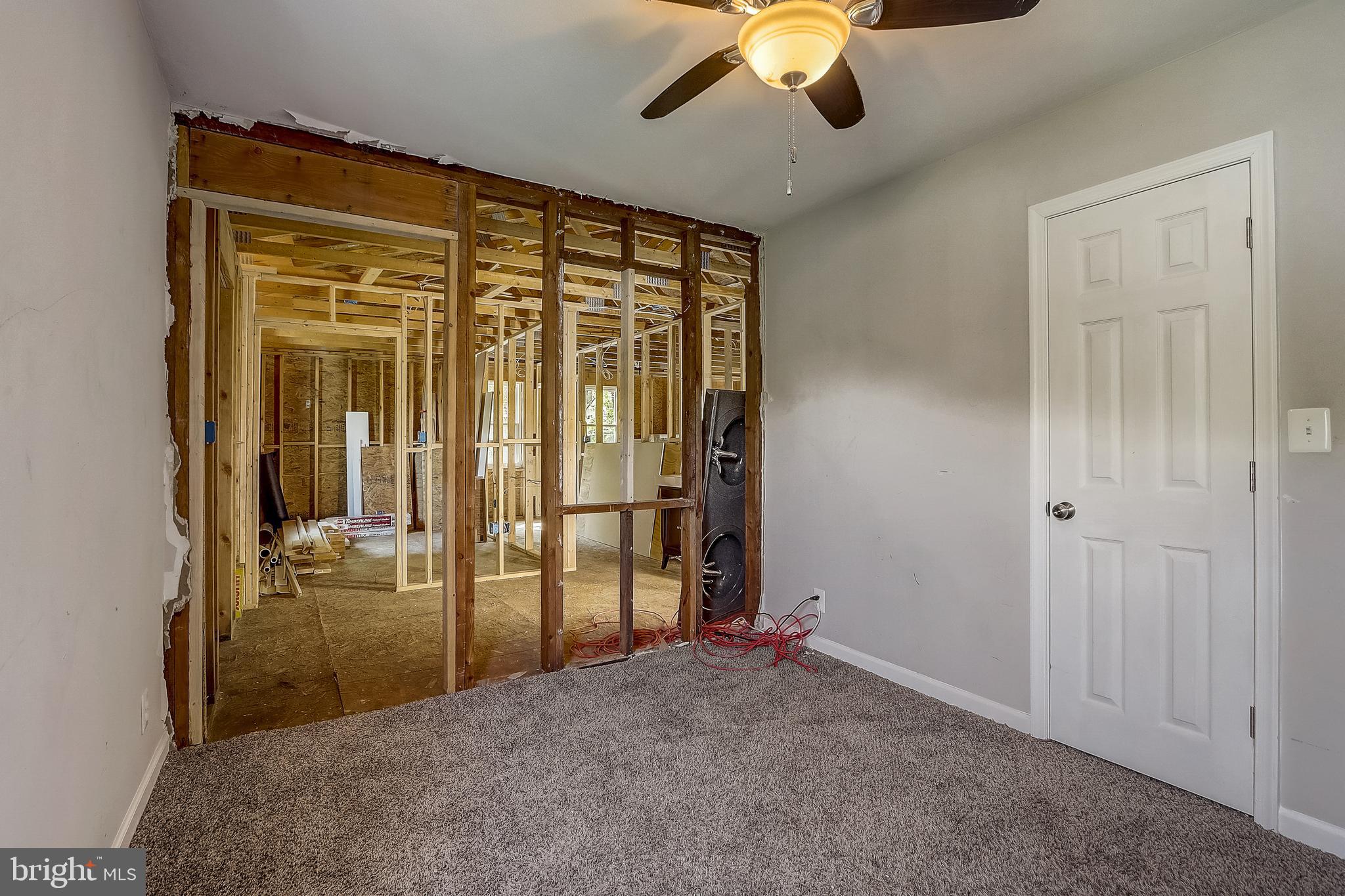 13221 Pine Road Bowie, MD 20720 - Photo 21 of 34 a view of a livingroom with a chandelier fan and a window