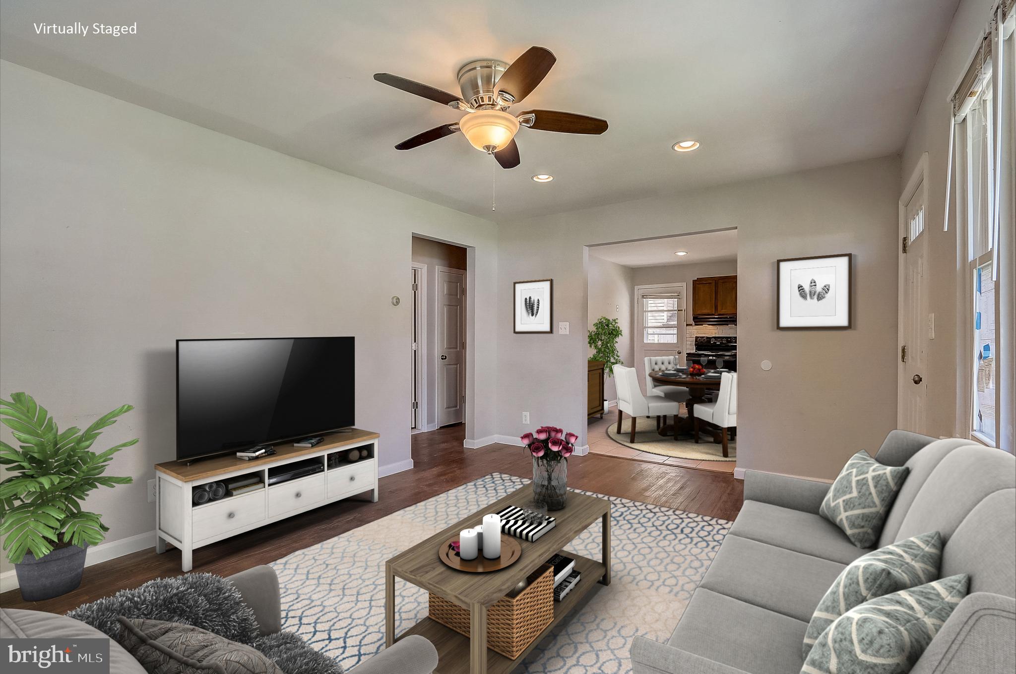 13221 Pine Road Bowie, MD 20720 - Photo 5 of 34 a living room with furniture and a flat screen tv