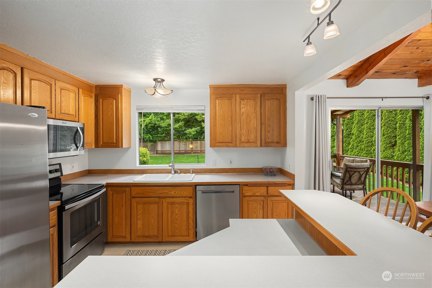 16604 3rd Avenue Southeast Bothell, WA 98012 - Photo 13 of 40 a kitchen with a sink a stove and cabinets