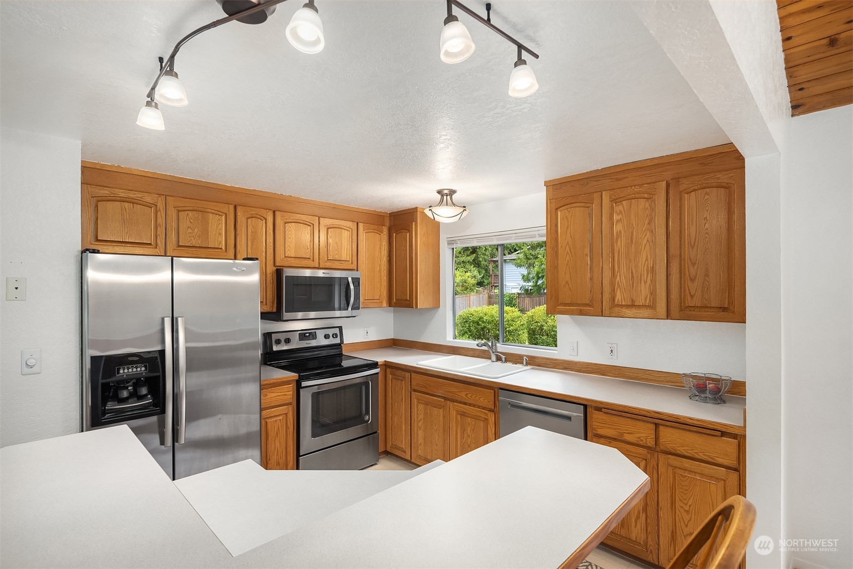 16604 3rd Avenue Southeast Bothell, WA 98012 - Photo 14 of 40 a kitchen with stainless steel appliances a refrigerator sink and microwave
