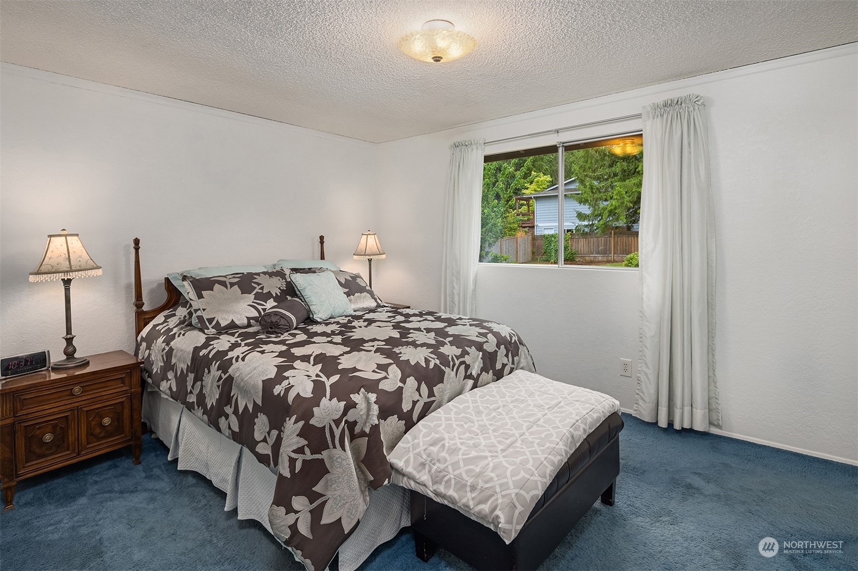 16604 3rd Avenue Southeast Bothell, WA 98012 - Photo 17 of 40 a bed sitting in a bedroom next to a window