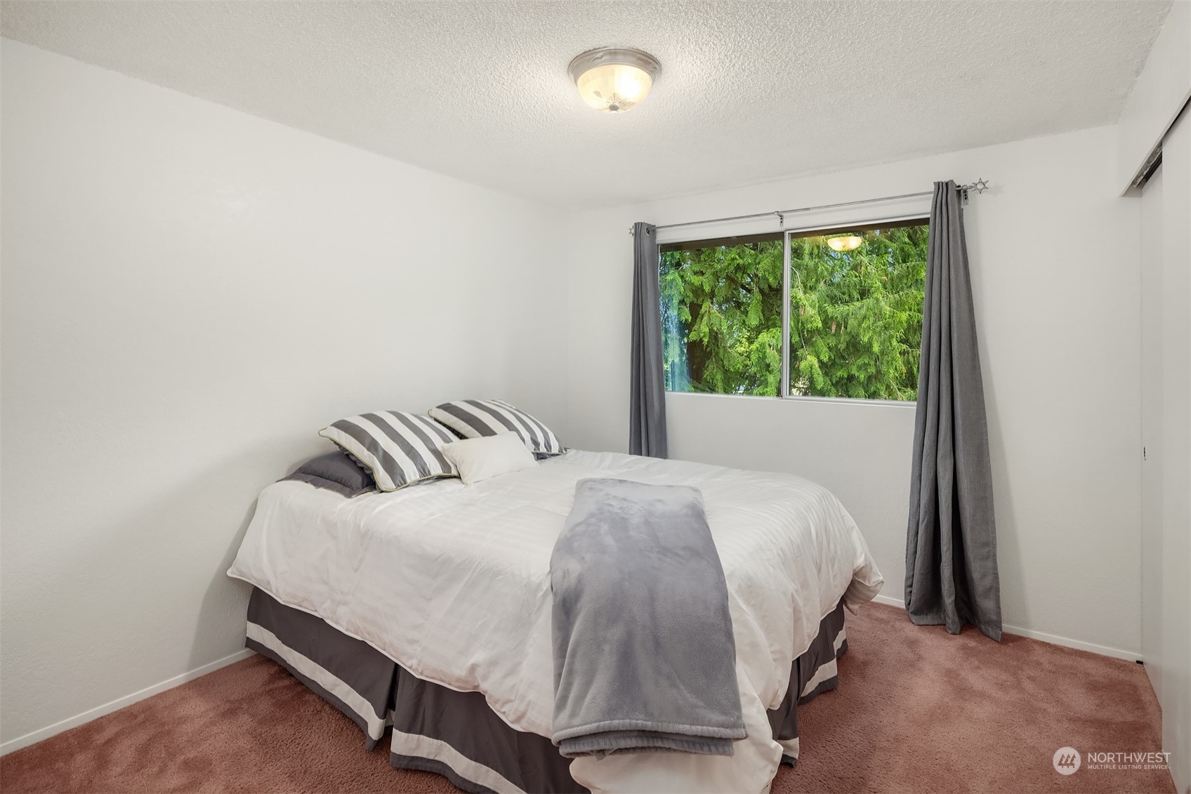 16604 3rd Avenue Southeast Bothell, WA 98012 - Photo 19 of 40 a bedroom with a bed and window