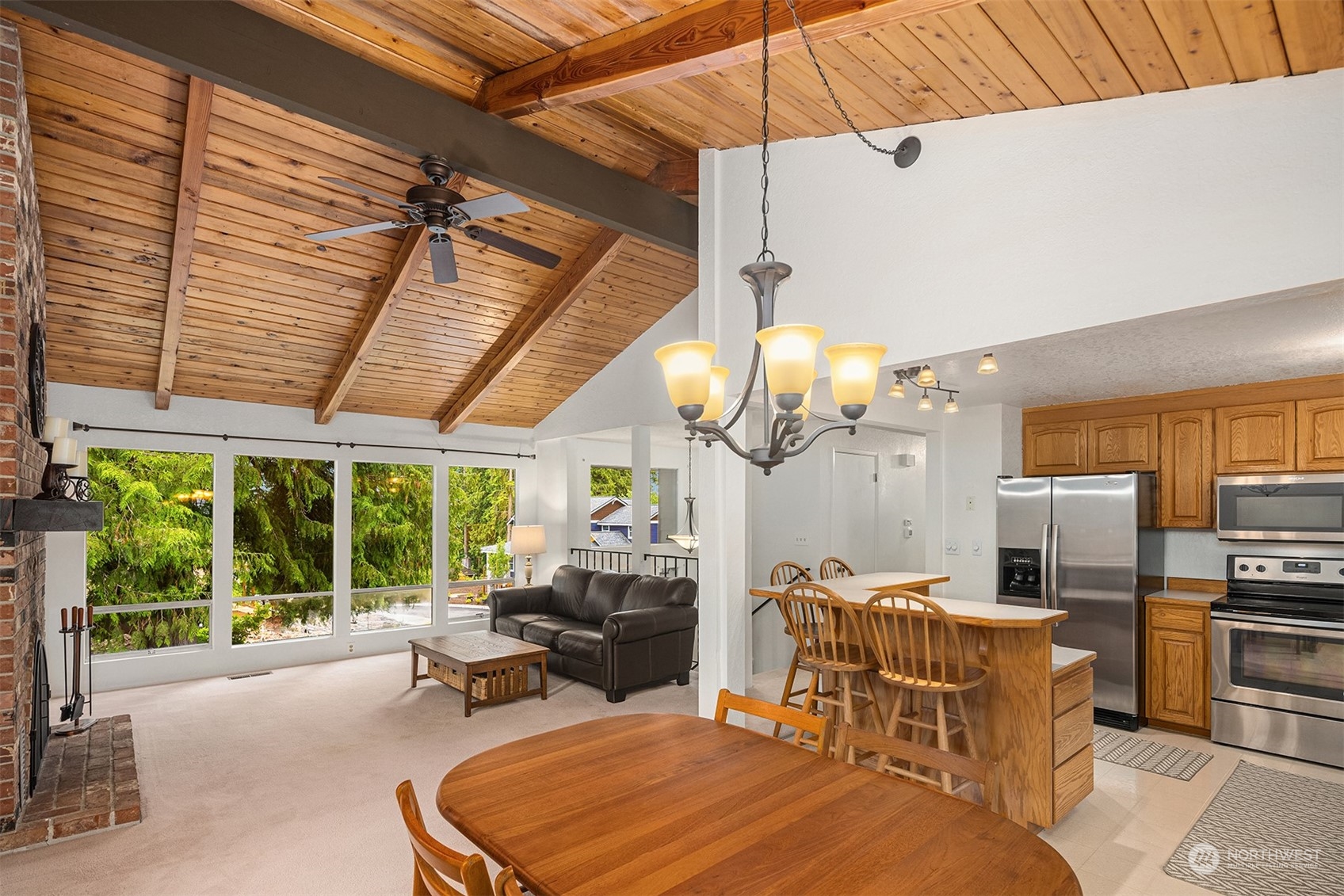 16604 3rd Avenue Southeast Bothell, WA 98012 - Photo 6 of 40 a room with furniture a chandelier a large window and a table