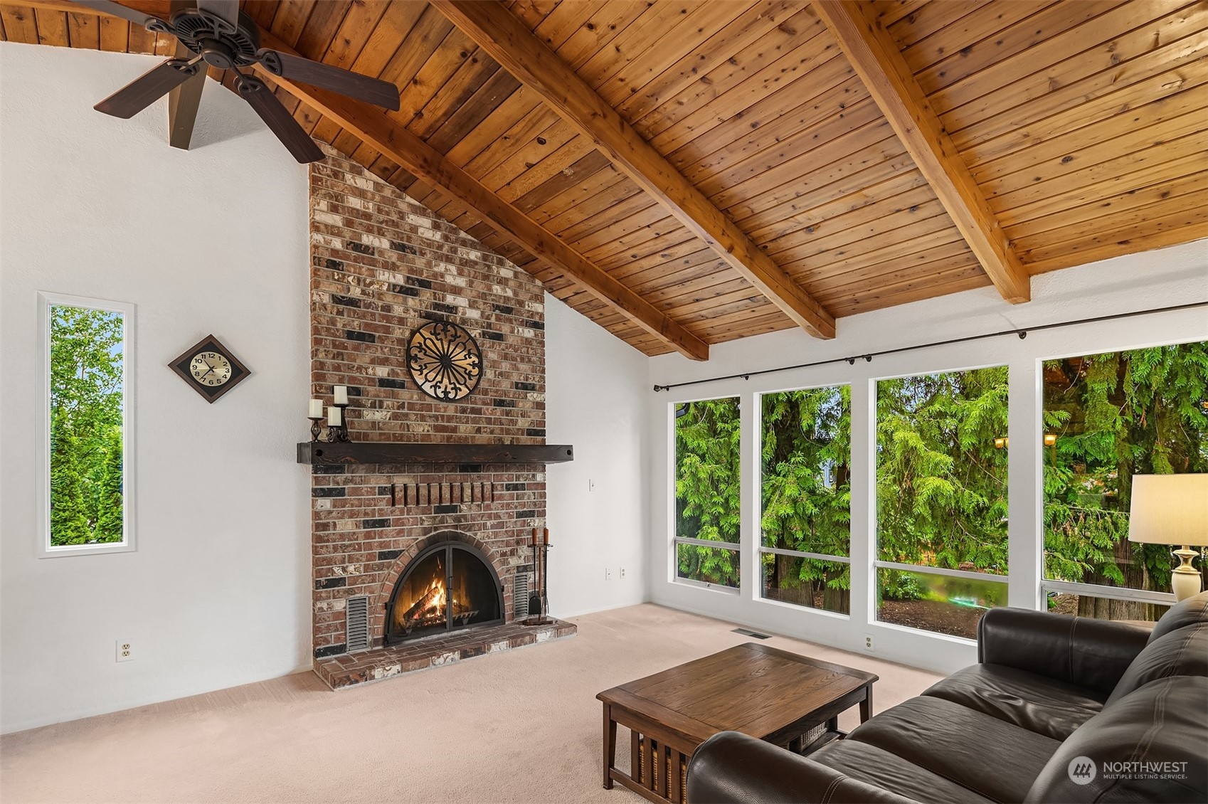 16604 3rd Avenue Southeast Bothell, WA 98012 - Photo 8 of 40 a living room with furniture a fireplace and a large window