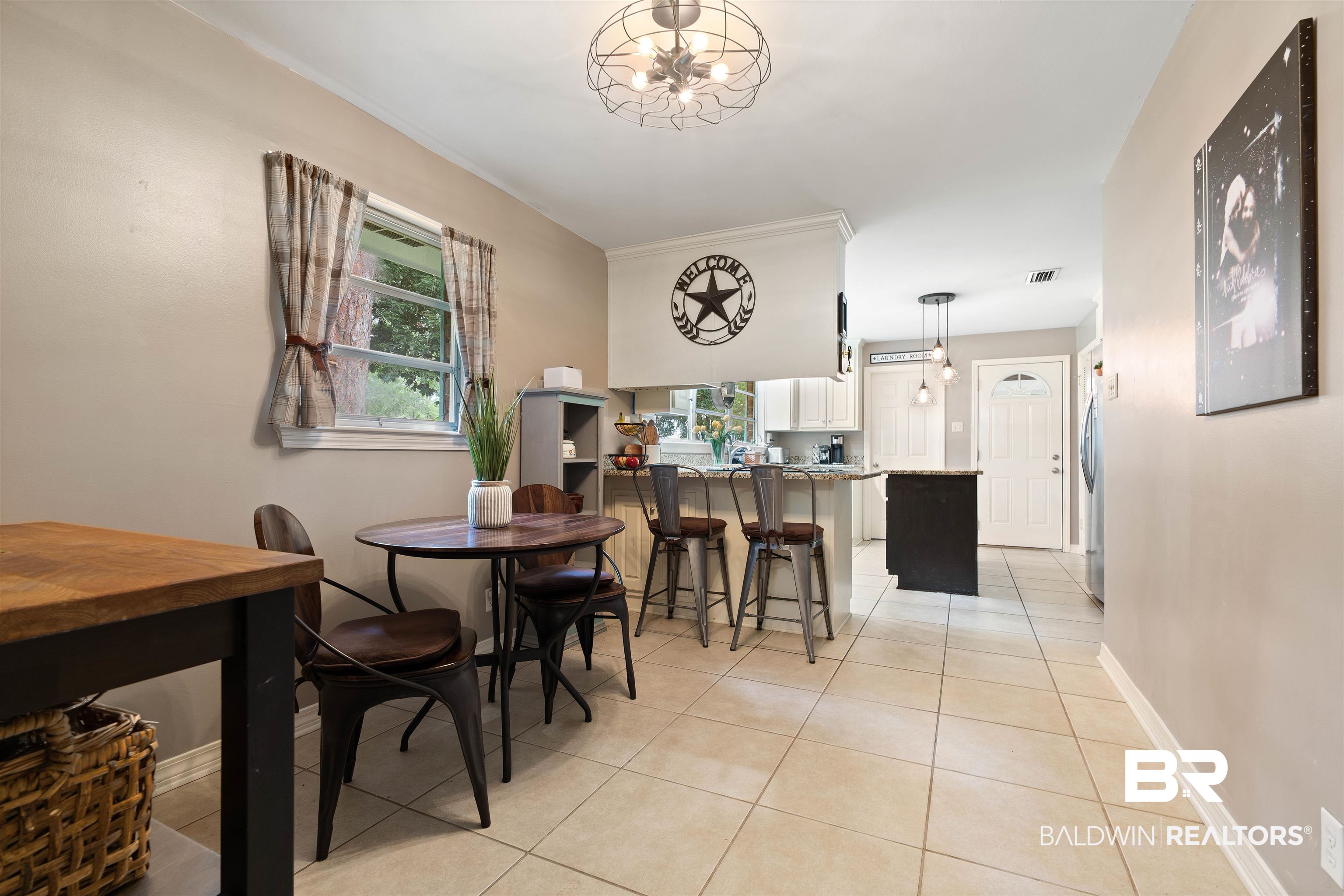 4051 East Canal Circle Mobile, AL 36619 - Photo 13 of 32 Dining space with light tile patterned flooring and crown molding