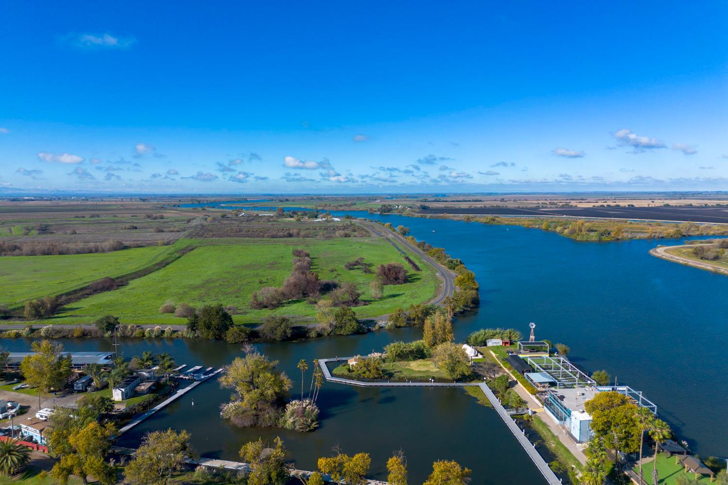 999511 West Rindge Road Stockton, CA 95219 - Photo 20 of 23 a view of a lake with lawn chairs