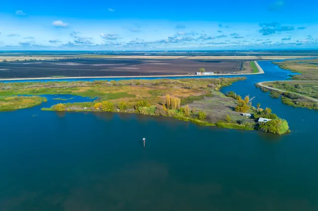 a view of an ocean and a yard