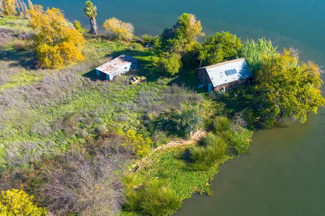 a bathroom with a sink a mirror and a shower