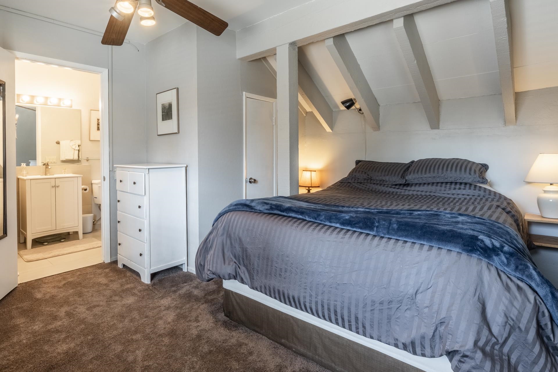 56 Davison Road, Unit 107 Mammoth Lakes, CA 93546 - Photo 13 of 28 a bedroom with a bed and a mirror