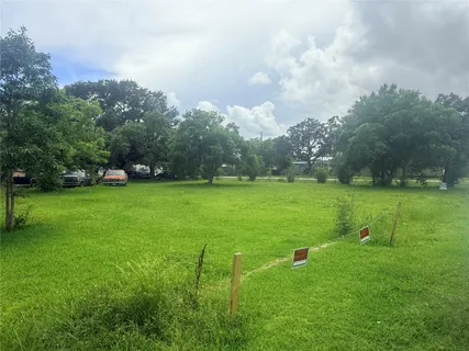 a view of a lake with a yard
