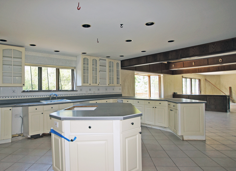 19411 Collins Road Marengo, IL 60152 - Photo 16 of 39 a kitchen with granite countertop a sink and white cabinets