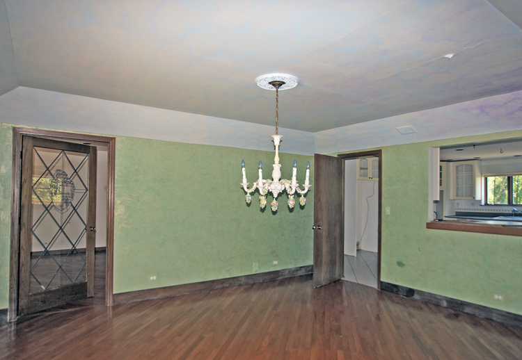19411 Collins Road Marengo, IL 60152 - Photo 17 of 39 a view of a room with window wooden floor and chandelier