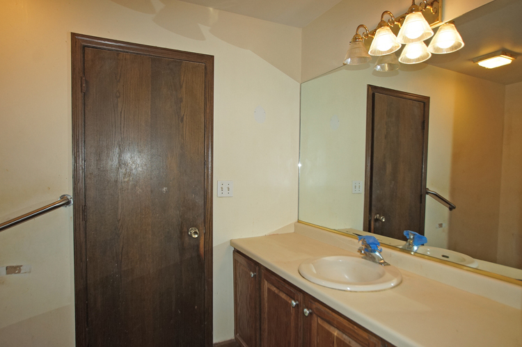 19411 Collins Road Marengo, IL 60152 - Photo 18 of 39 a bathroom with a sink vanity and a mirror