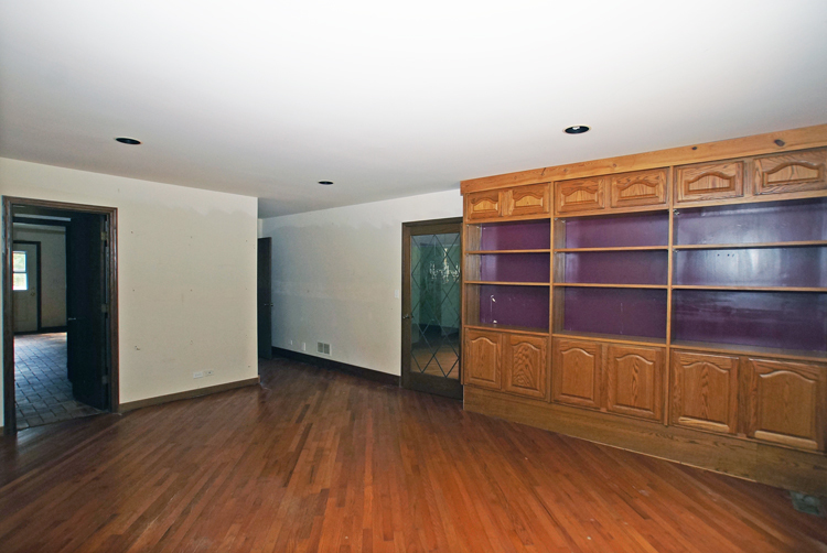 19411 Collins Road Marengo, IL 60152 - Photo 19 of 39 a view of an empty room with wooden floor and a window