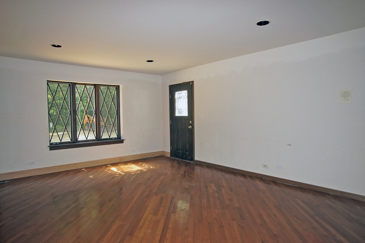 19411 Collins Road Marengo, IL 60152 - Photo 20 of 39 a view of an empty room with wooden floor and a window