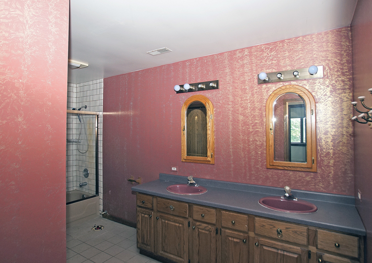 19411 Collins Road Marengo, IL 60152 - Photo 29 of 39 a bathroom with a sink and two mirror