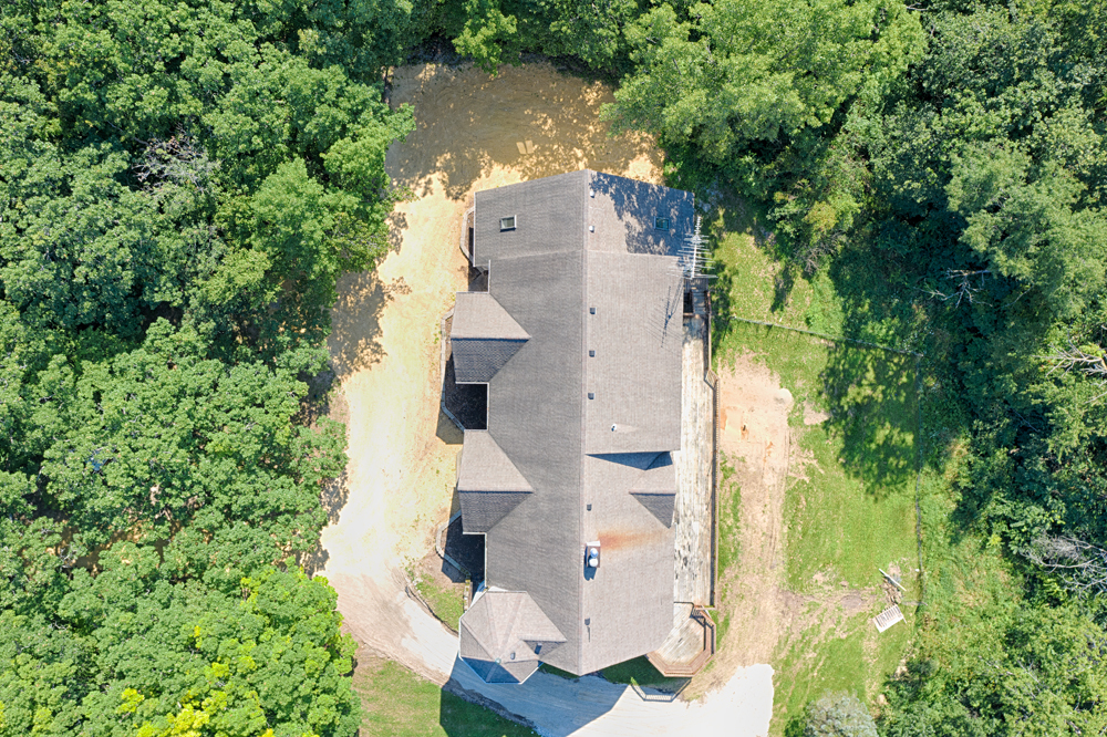 19411 Collins Road Marengo, IL 60152 - Photo 8 of 39 an aerial view of residential house with outdoor space and trees all around