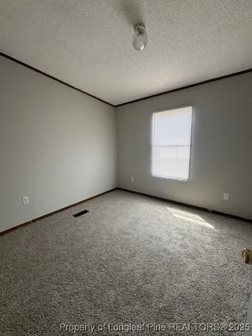 an empty room with a empty space and window