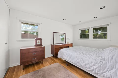 a bedroom with a bed and a dresser