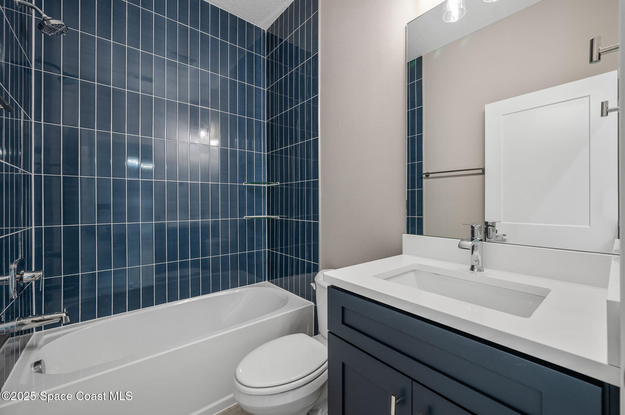 1107 Conquistador Drive Rockledge, FL 32955 - Photo 13 of 14 a bathroom with a sink a toilet and bathtub