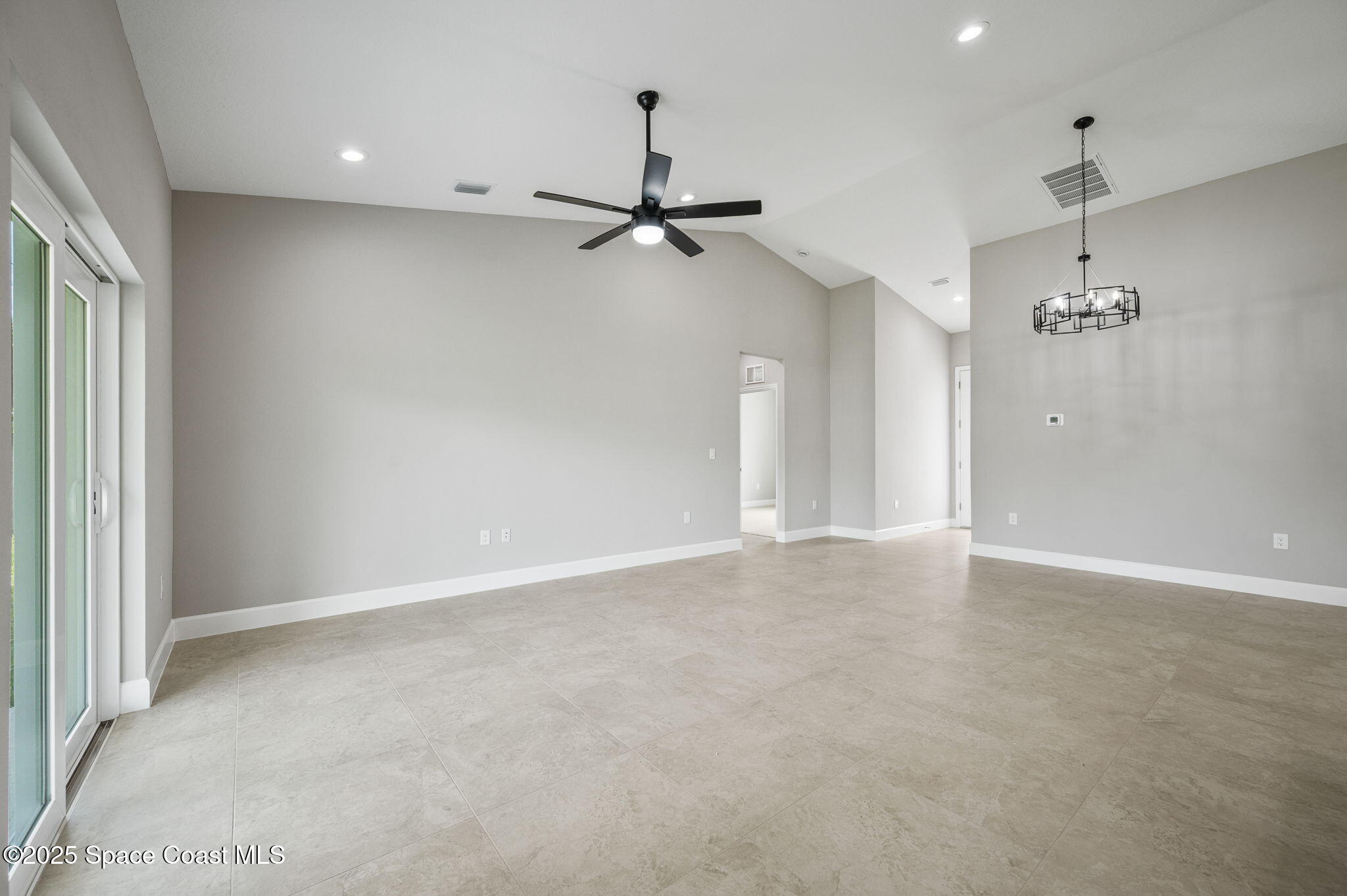 1107 Conquistador Drive Rockledge, FL 32955 - Photo 6 of 14 an empty room with fan