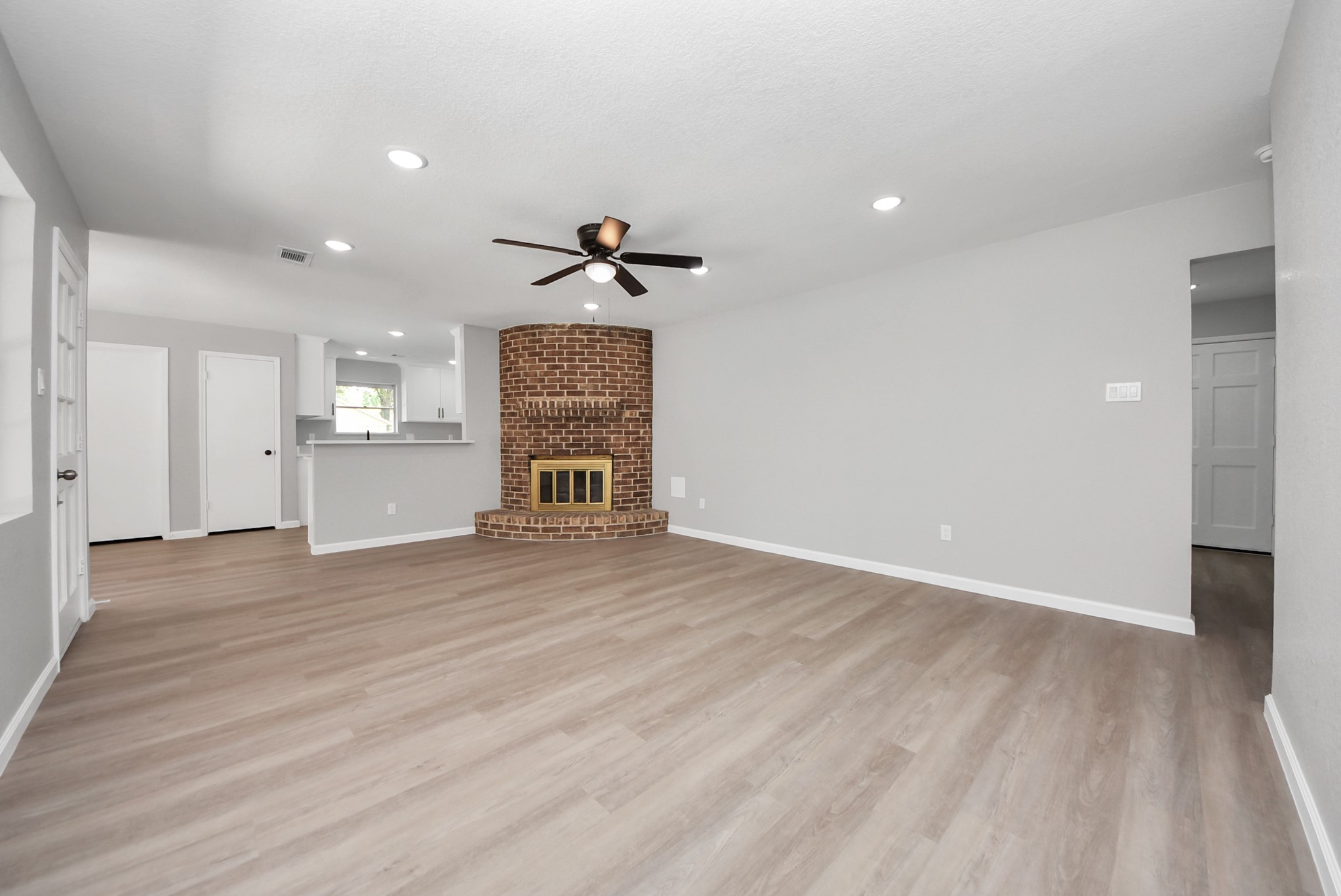 2402 Rolling Glen Drive Spring, TX 77373 - Photo 7 of 38 a view of empty room with wooden floor and a window
