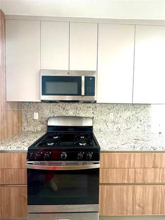 a view of kitchen with wooden floor