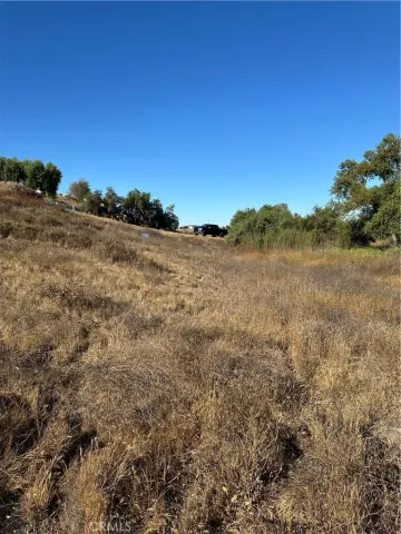 a view of a large building with mountains in the background